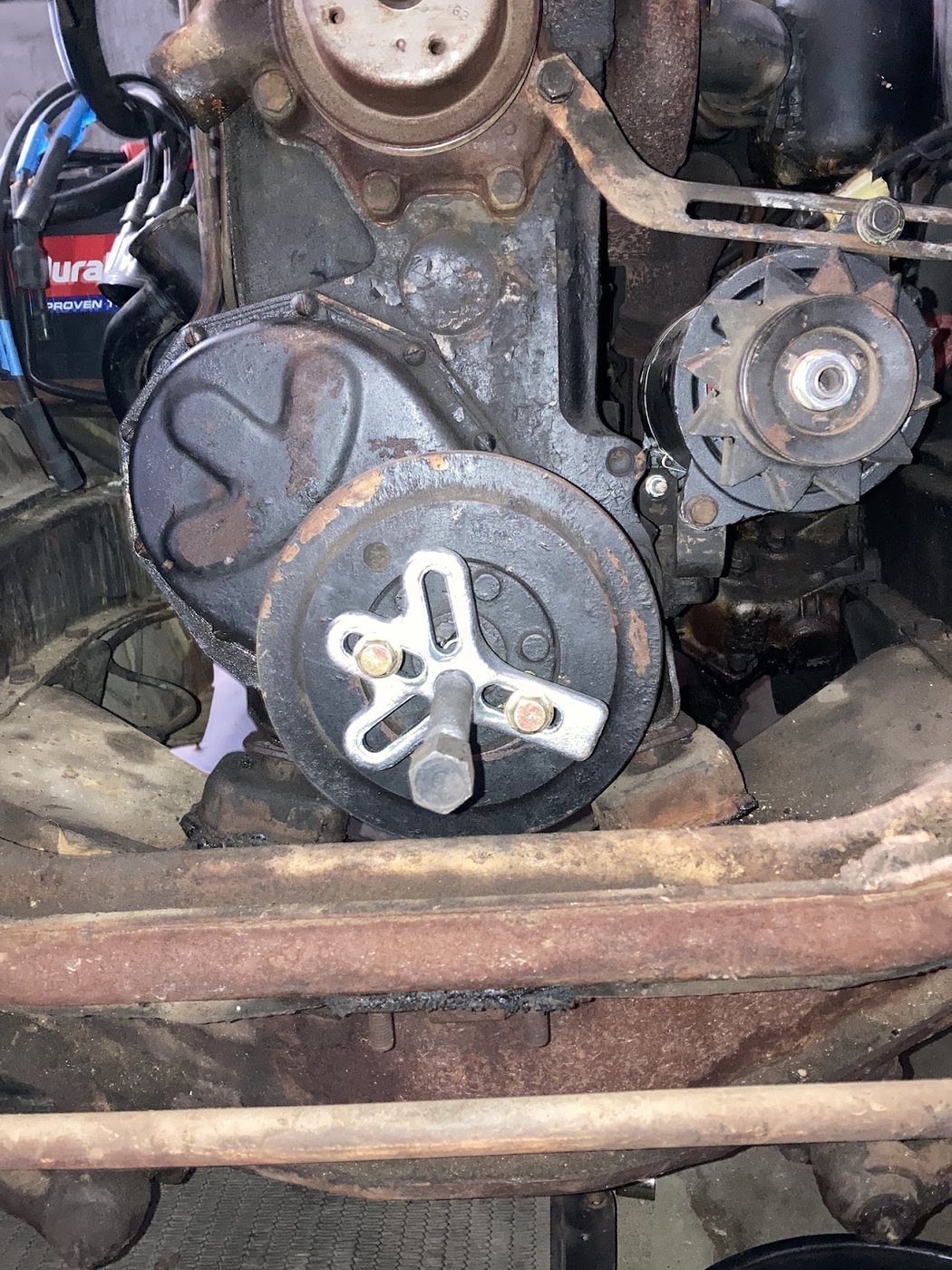Harmonic balancer being removed with a puller
